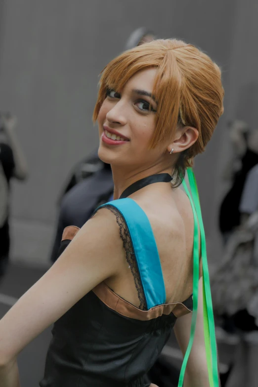 a woman in black dress wearing a green and neon ponytail