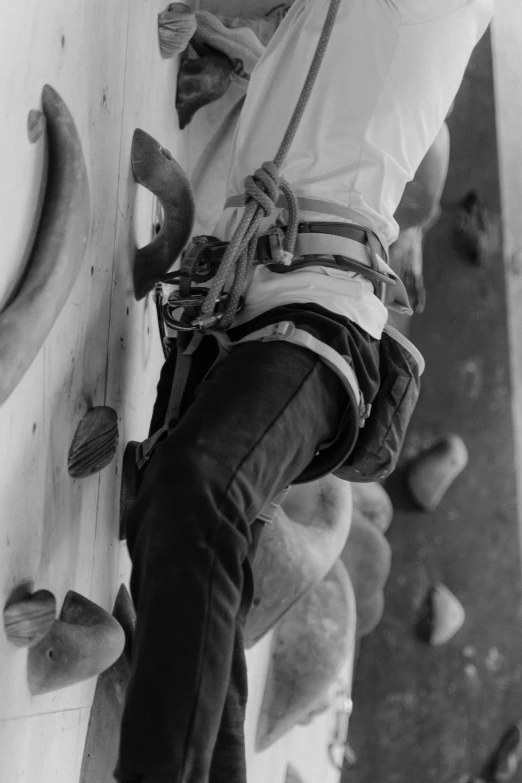 black and white pograph of a man in climbing gear