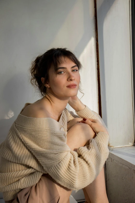 a woman posing with her arm resting on the side