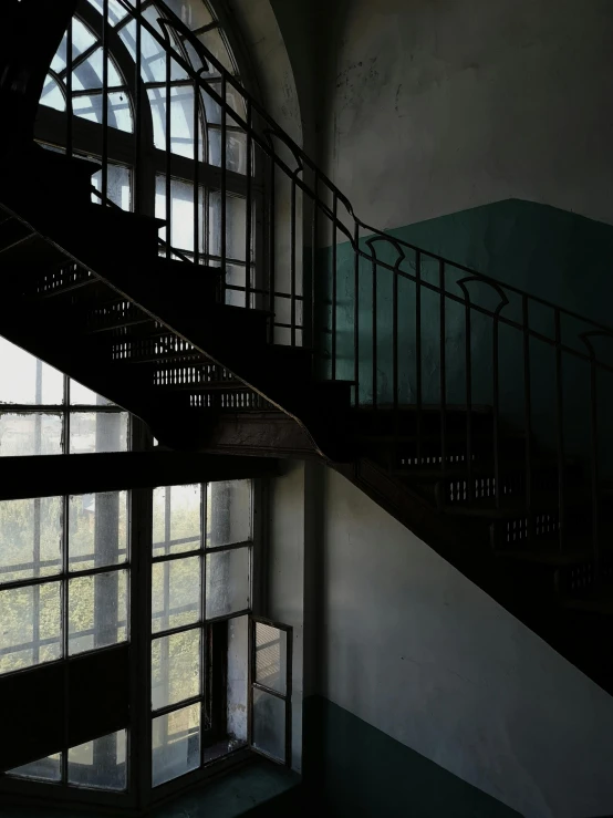 an old spiral staircase in an abandoned building