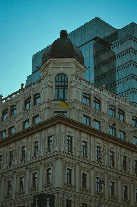 a tan building with some very big windows