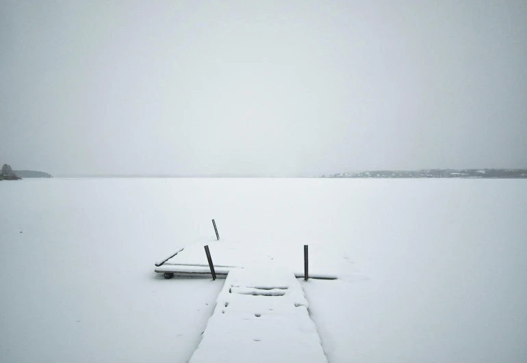 two poles on the water in front of the water