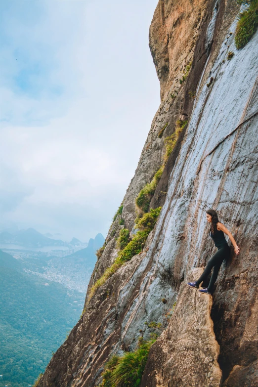 man on a ledge, climbing on the cliff