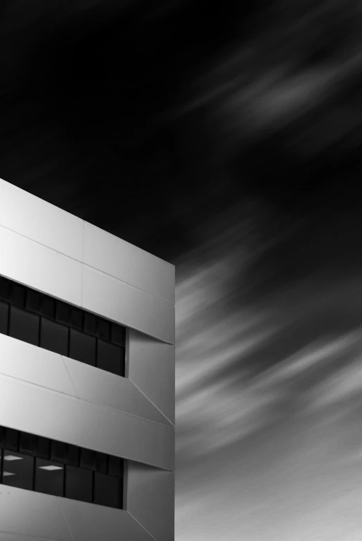 a white building in the middle of a black and white po