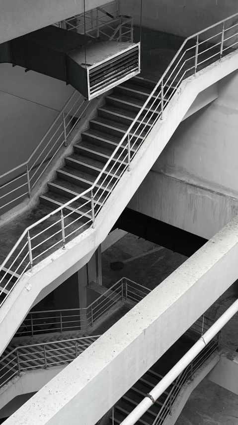 an image of two stairways in black and white