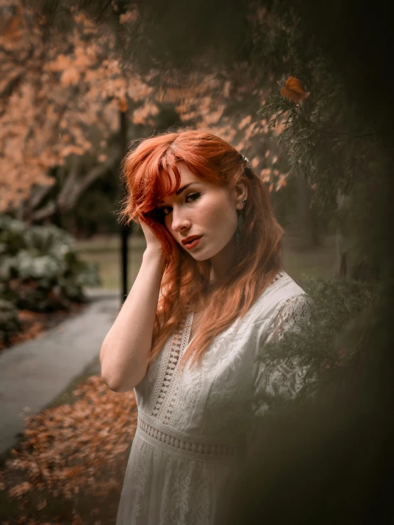 a woman holding her head in the wind