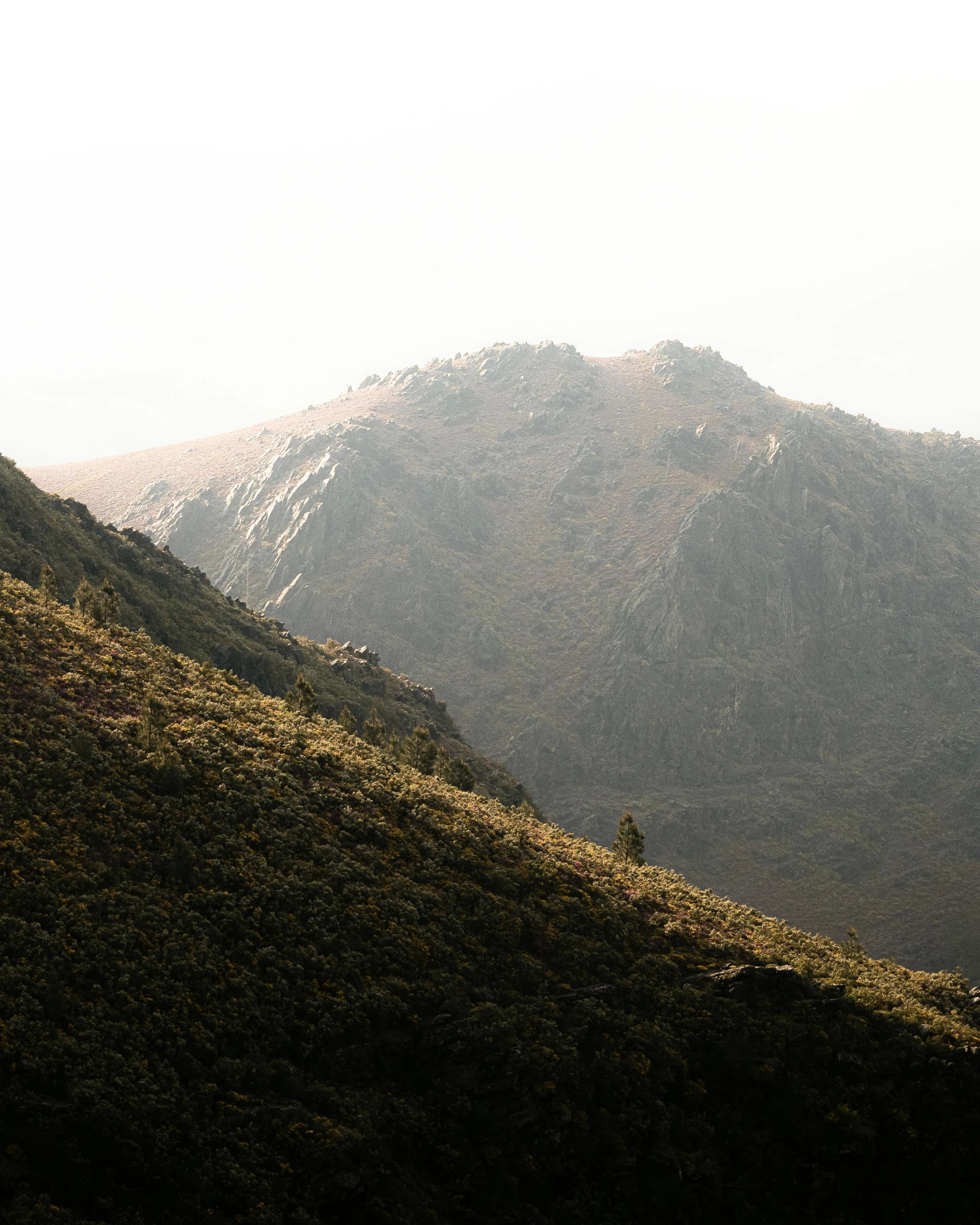 the view of a hill is very distant from the viewer