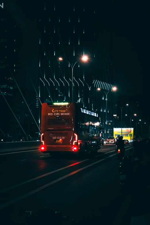 several red buses driving down a city street