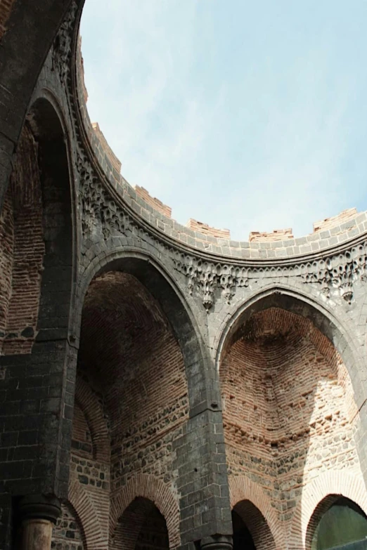 a close up of a building with arches and sky