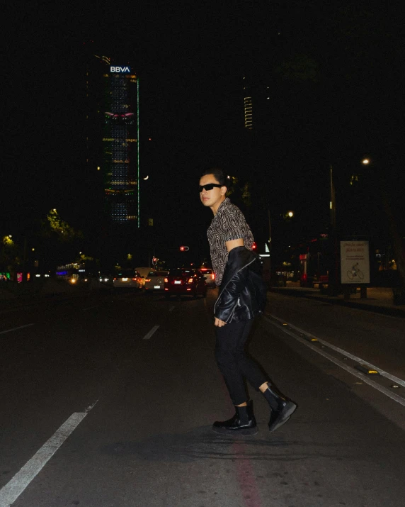 a young woman walking in the middle of an empty street