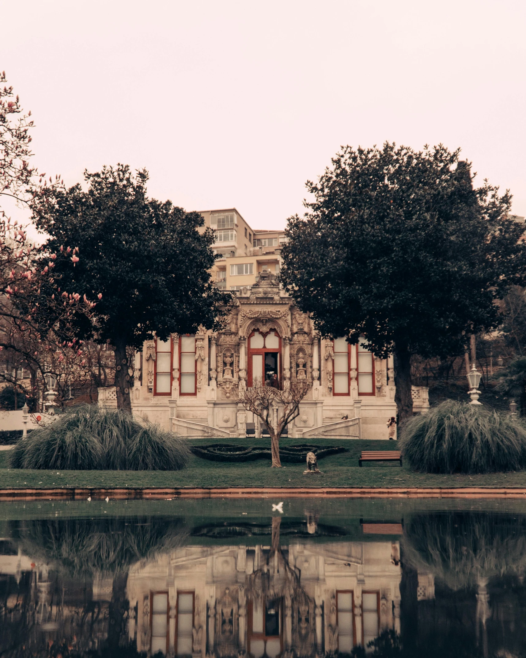 a pond that is in front of a building