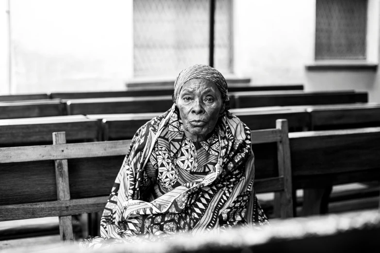 a woman sitting on a pew in a church