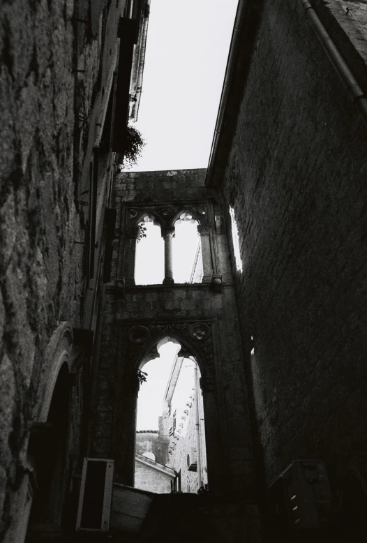 view of two archways through brick walls at an old city