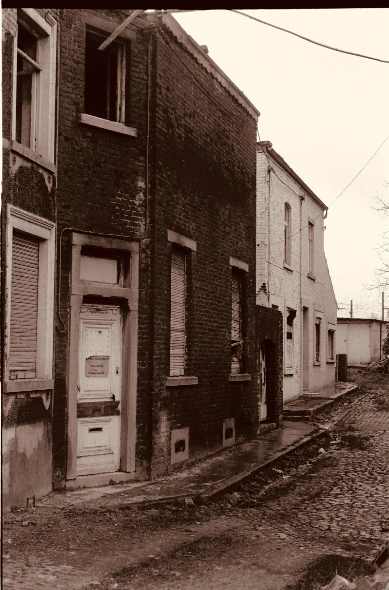 an old black and white pograph of buildings