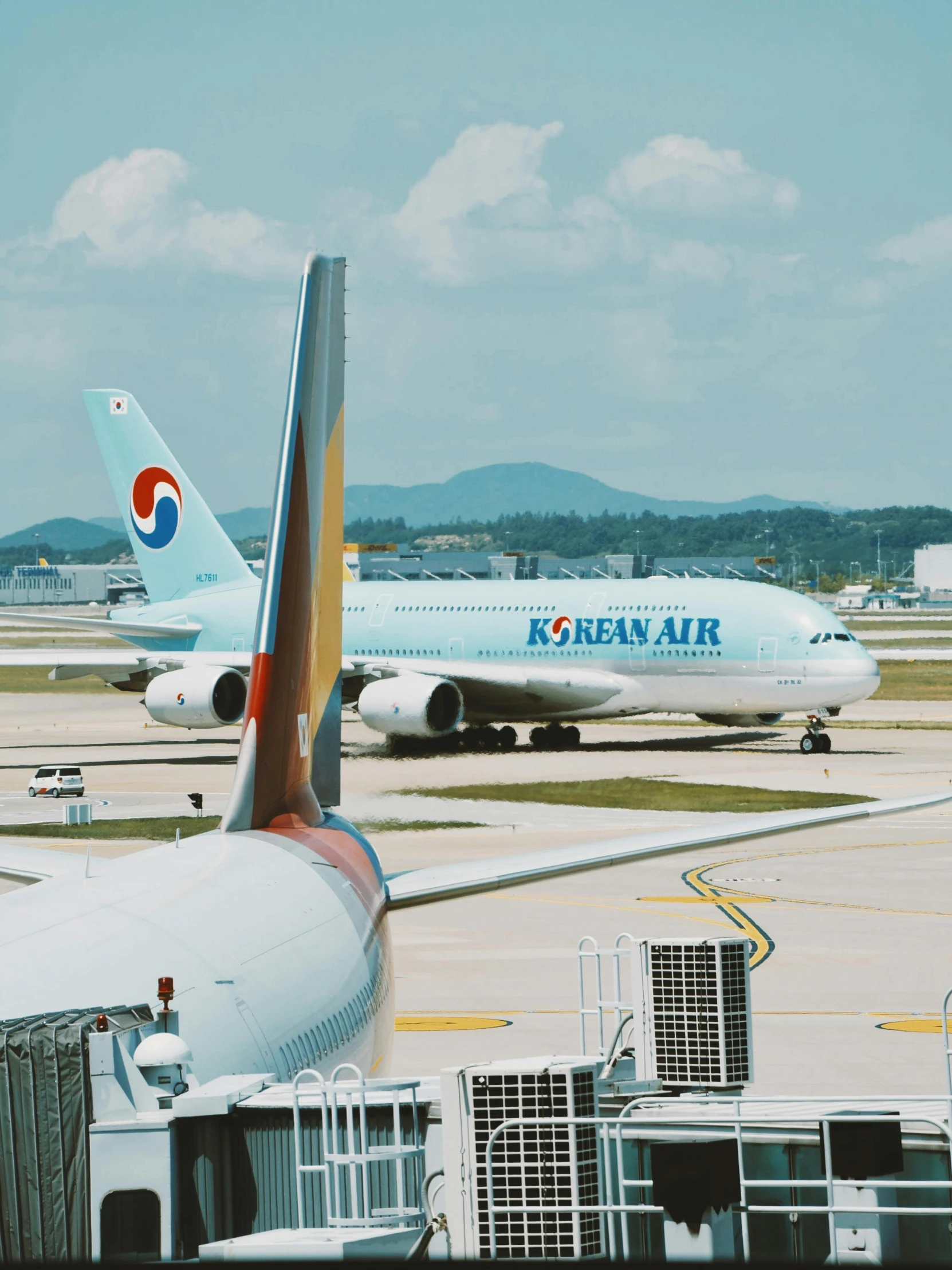 two jet planes on the tarmac of an airport