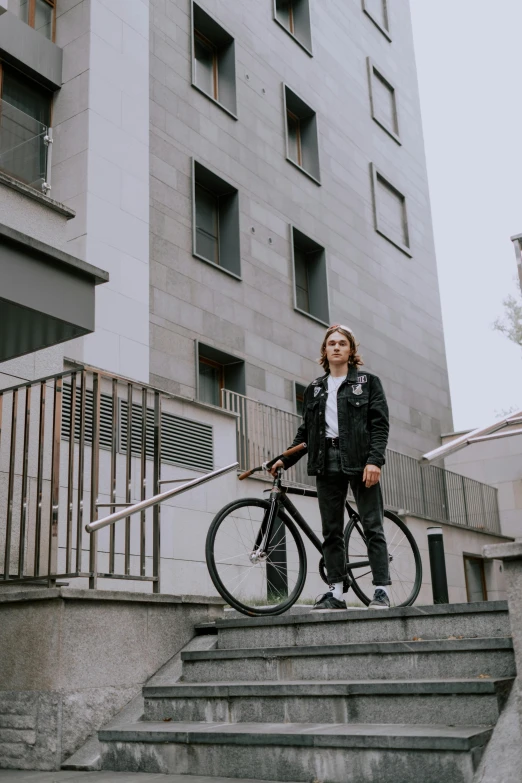 a person on a stair case next to a bike