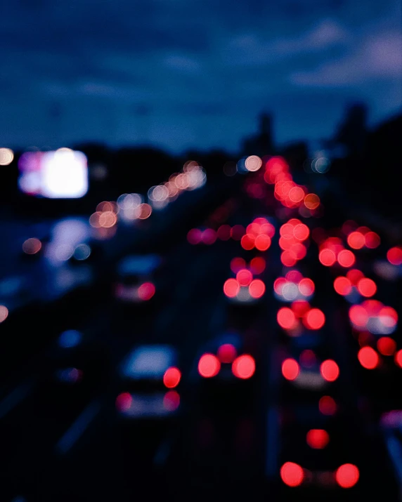 a night view shows many cars moving fast on the highway