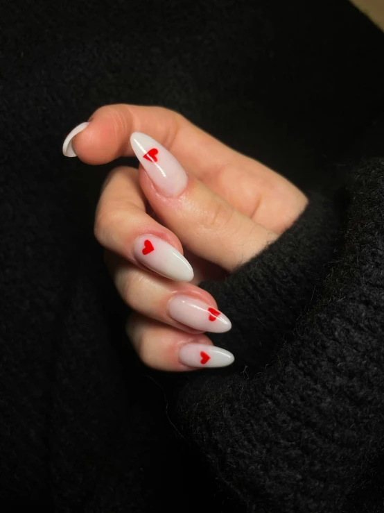 a hand that has been decorated with a  - splattered nail