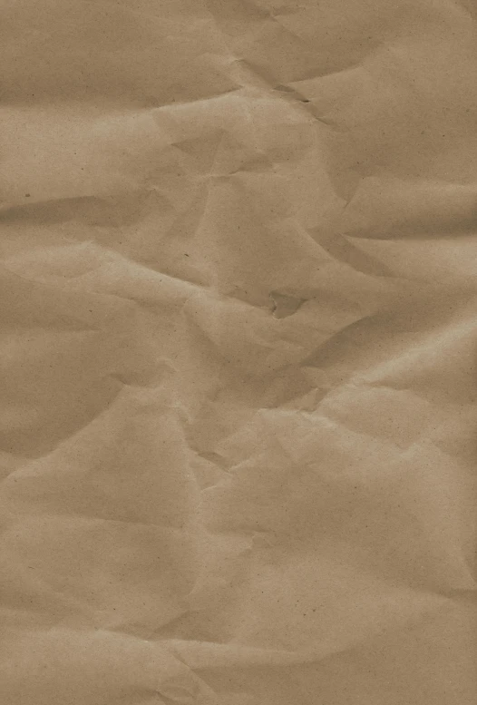 a brown piece of paper with lines and spots of light on it