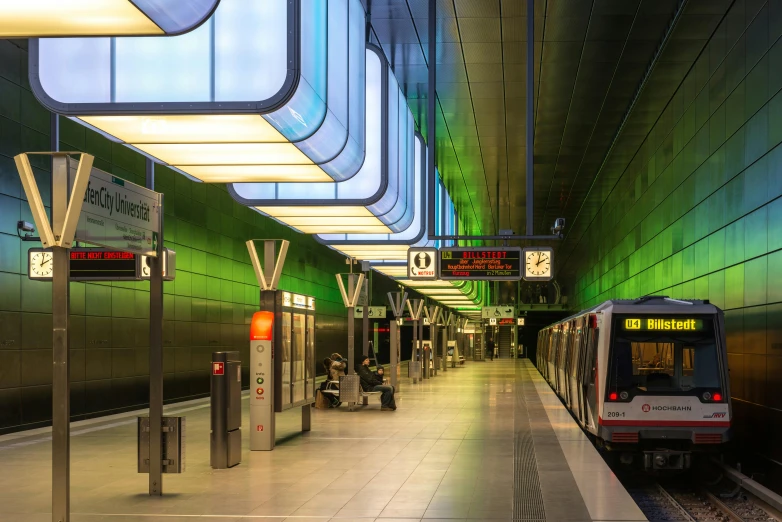 a train is coming down the tracks near a platform