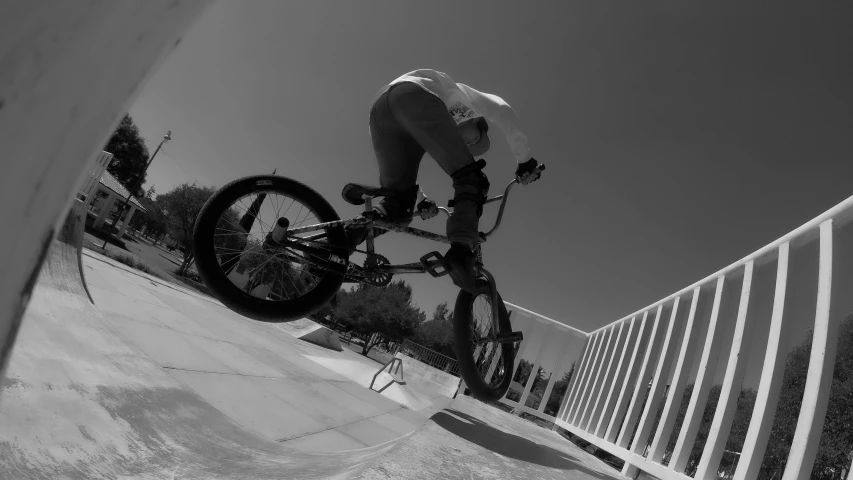 a black and white po of a boy on a skateboard