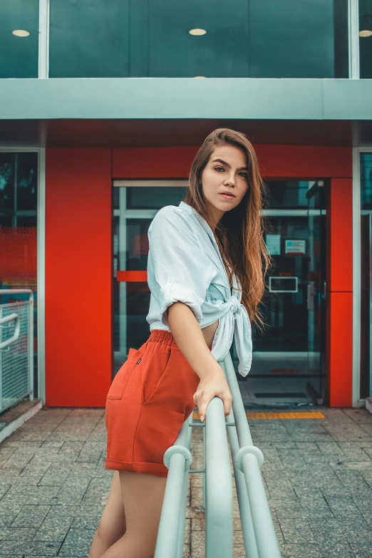 an asian woman posing with her hands on her hips