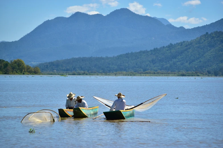 two men in a boat out on the water