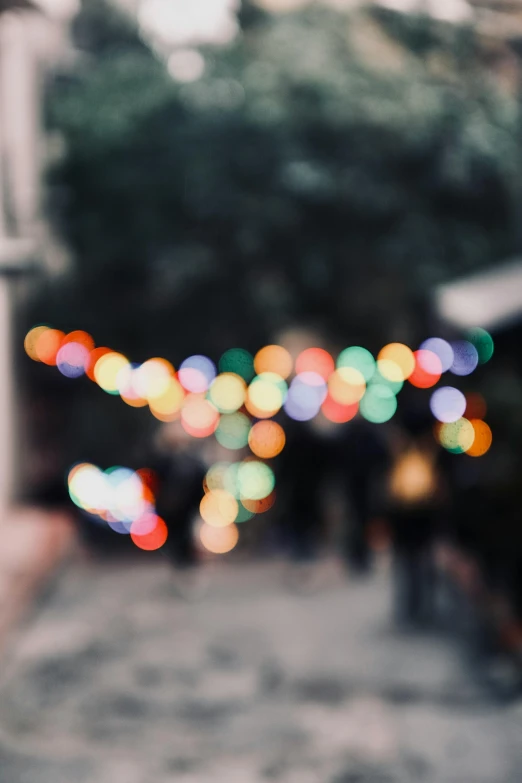 blurry, colorful lights at night are shown from outside a building