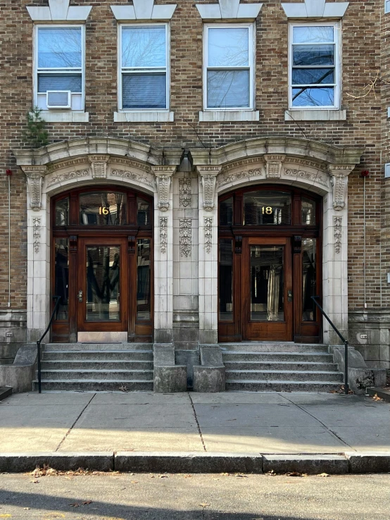 a building with steps to the door and windows