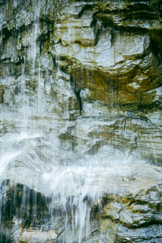 the top of a waterfall falling down in to the bottom