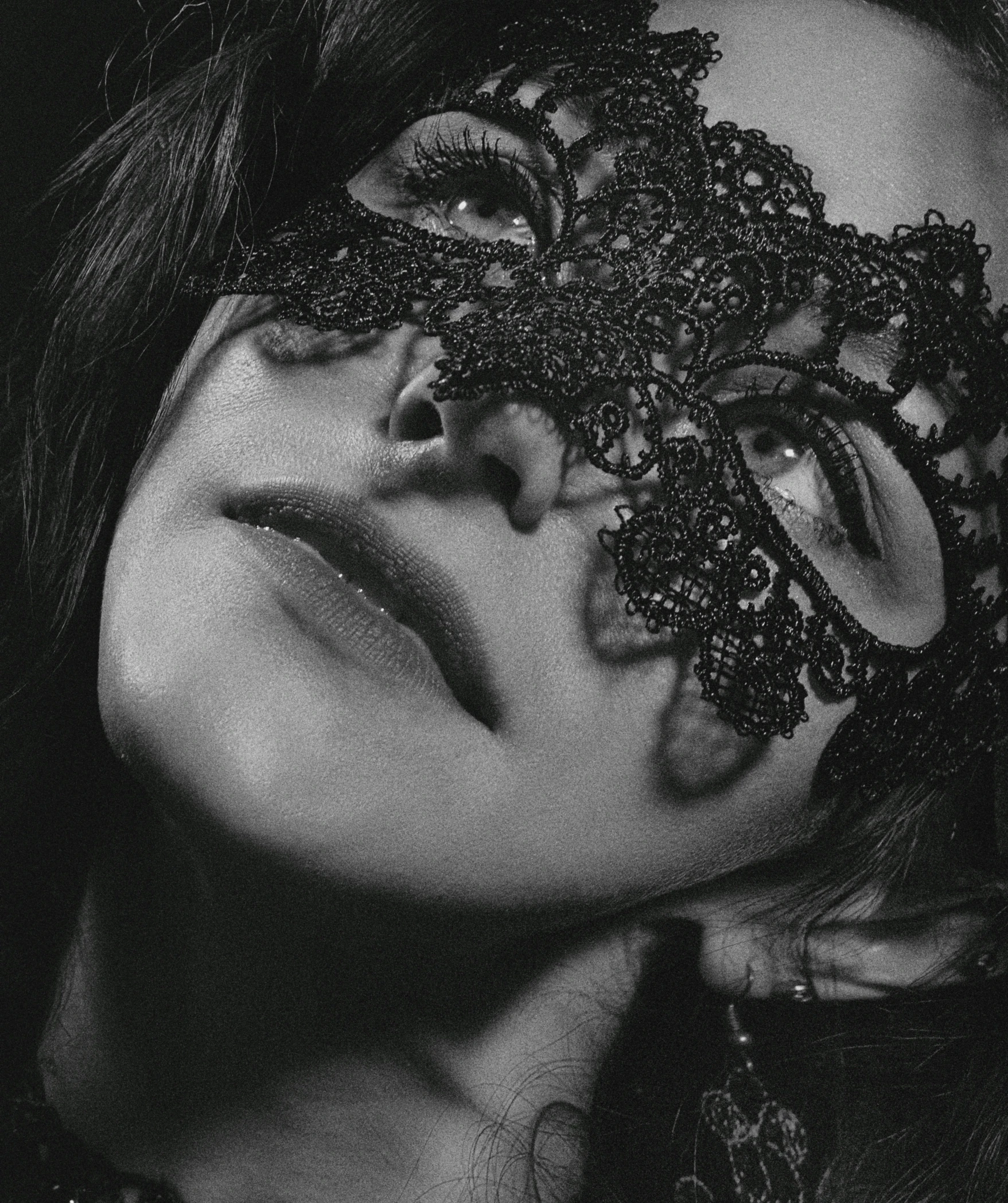 woman with ornate mask on black and white po