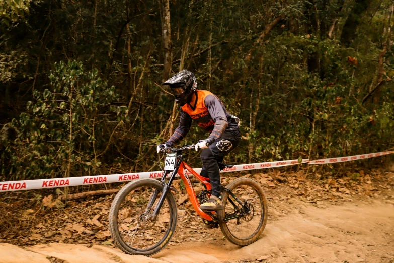 a downhill rider is riding through the course