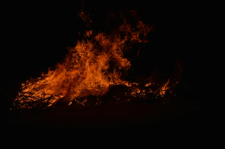 an image of bonfire blazing in the dark