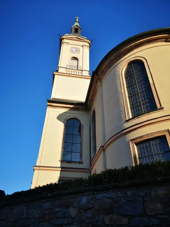 a building with a steeple and clock on it