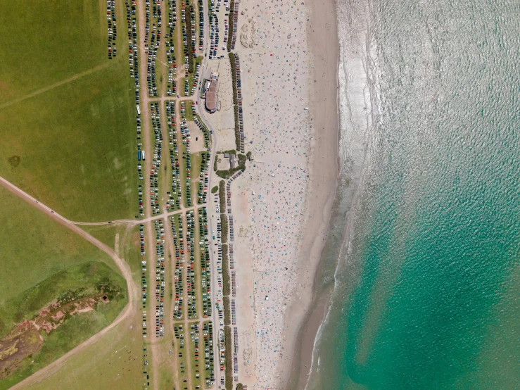 an aerial po of an airplane flying over the ocean