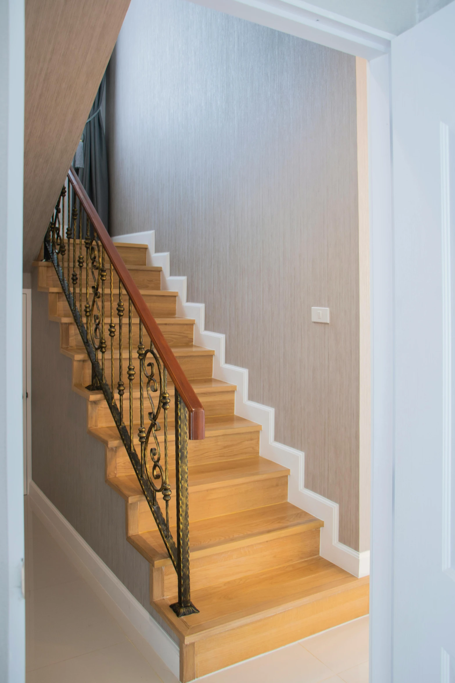 an open stair railing and staircase in a small room