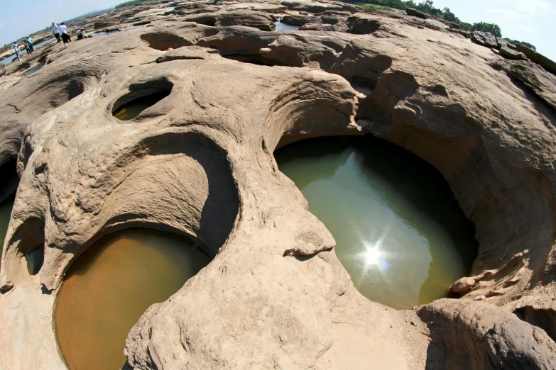 the rocks look like they are being shaped in water