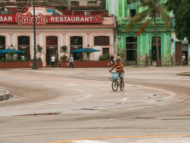 a man is riding a bicycle on the street