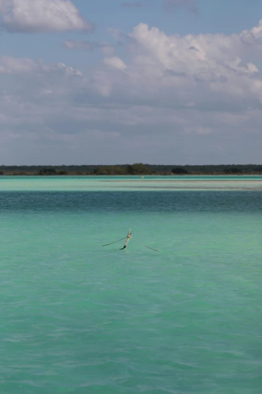 a lone boat in an open calm ocean