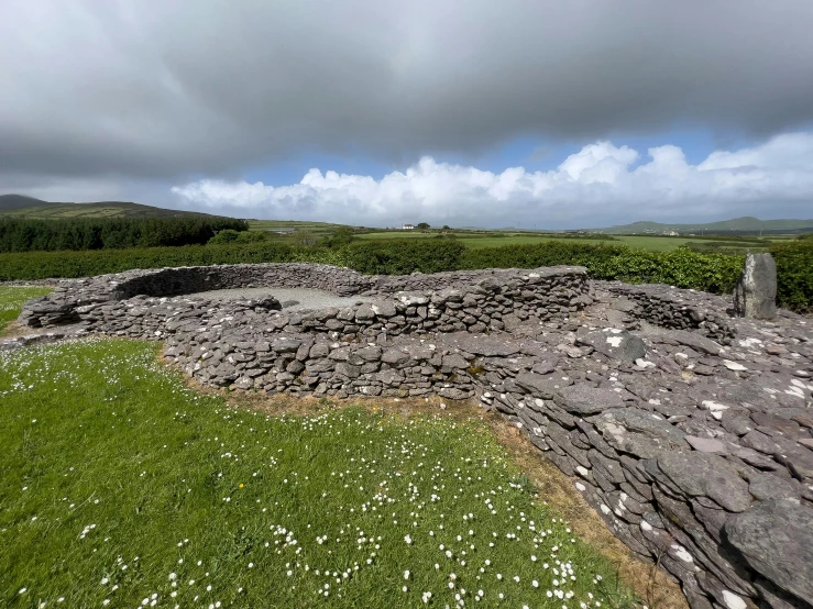 a couple of rocks with grass on each side