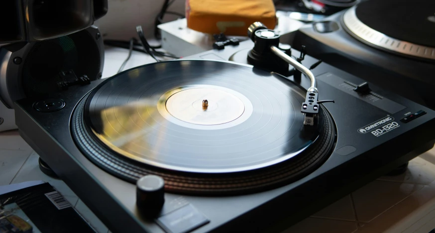 an old record player has its turntable broken