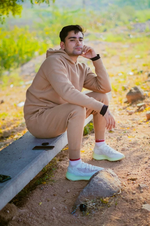 a person sitting on a bench outside