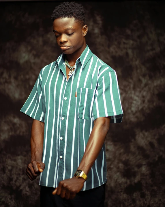 an african american male model wearing a striped shirt