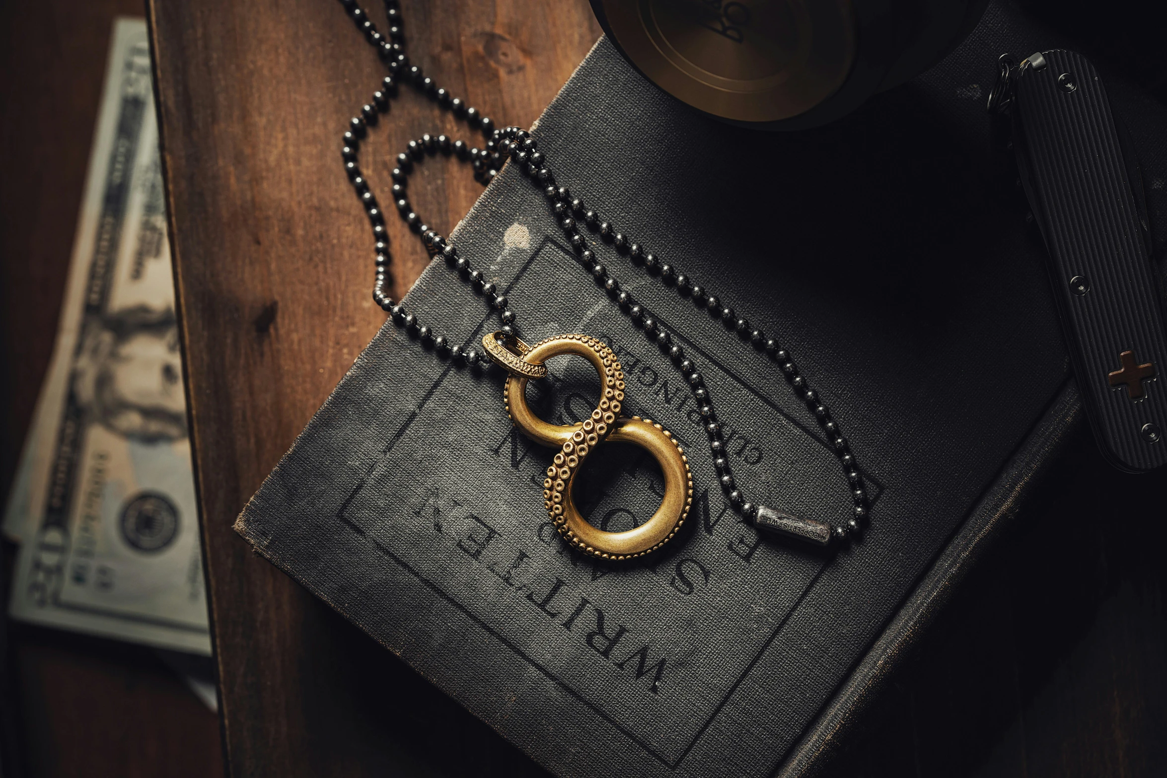 a picture of a pendant hanging on a book