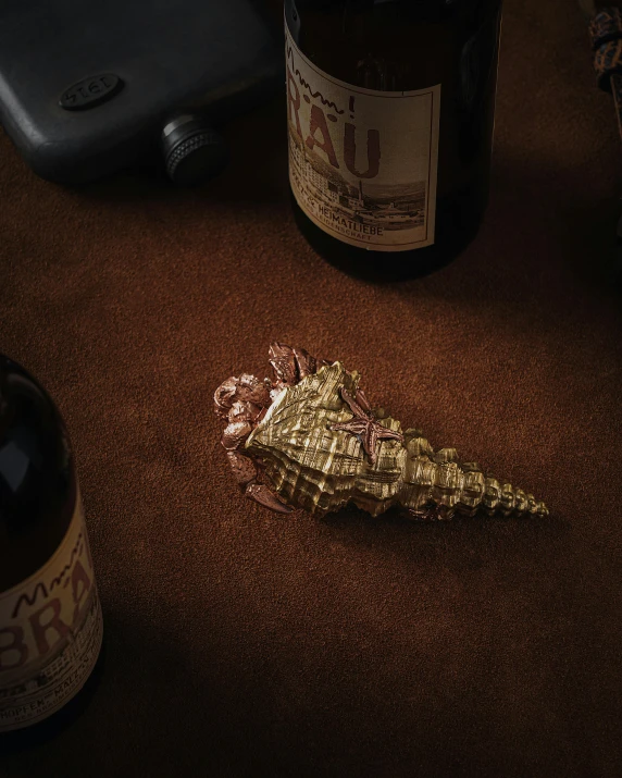 a close up of two bottles on a brown table