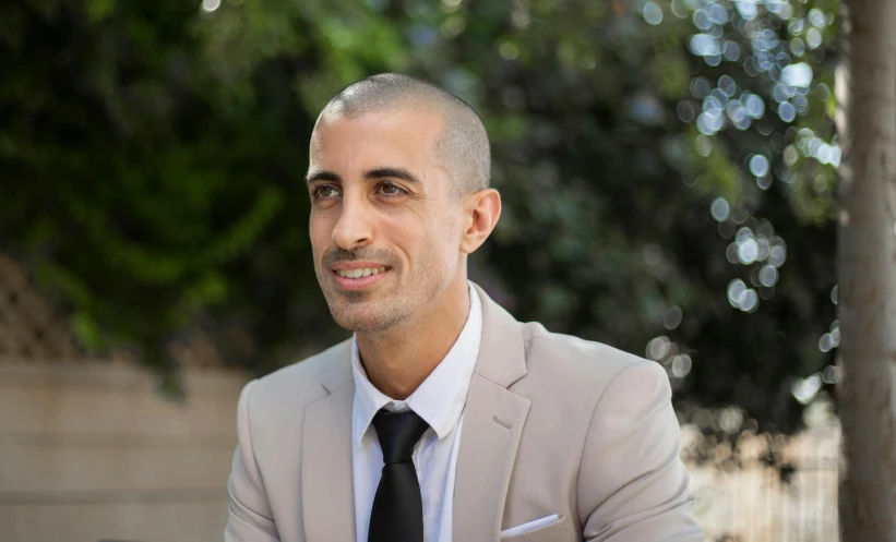 a man with a white shirt and gray suit jacket, white shirt and black tie