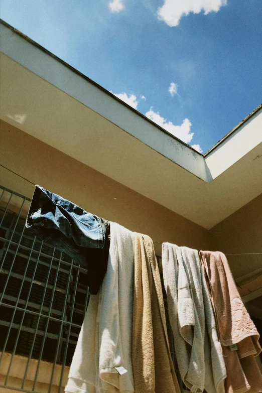 clothes on drying outside in front of a house