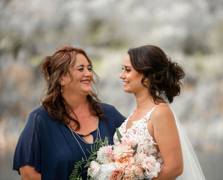 a couple of women standing next to each other