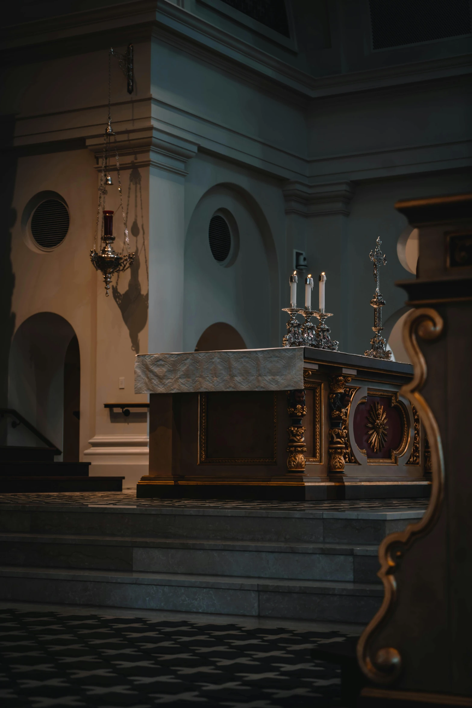 the inside of a church with pews and a cross