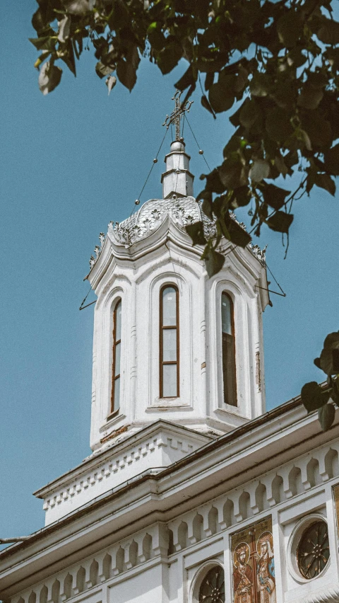 a large church tower with a clock on top